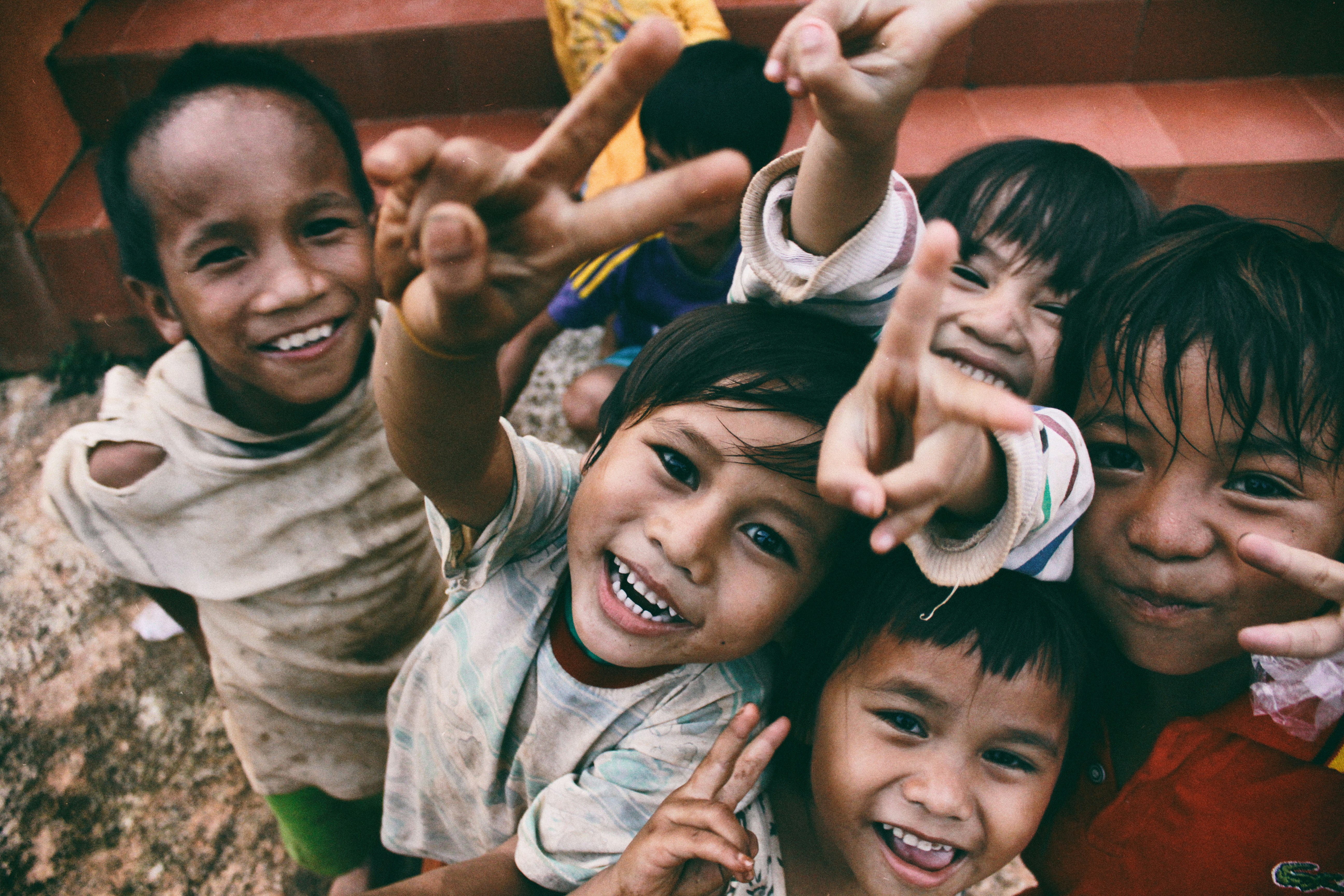 Smiling children supported by a community charity