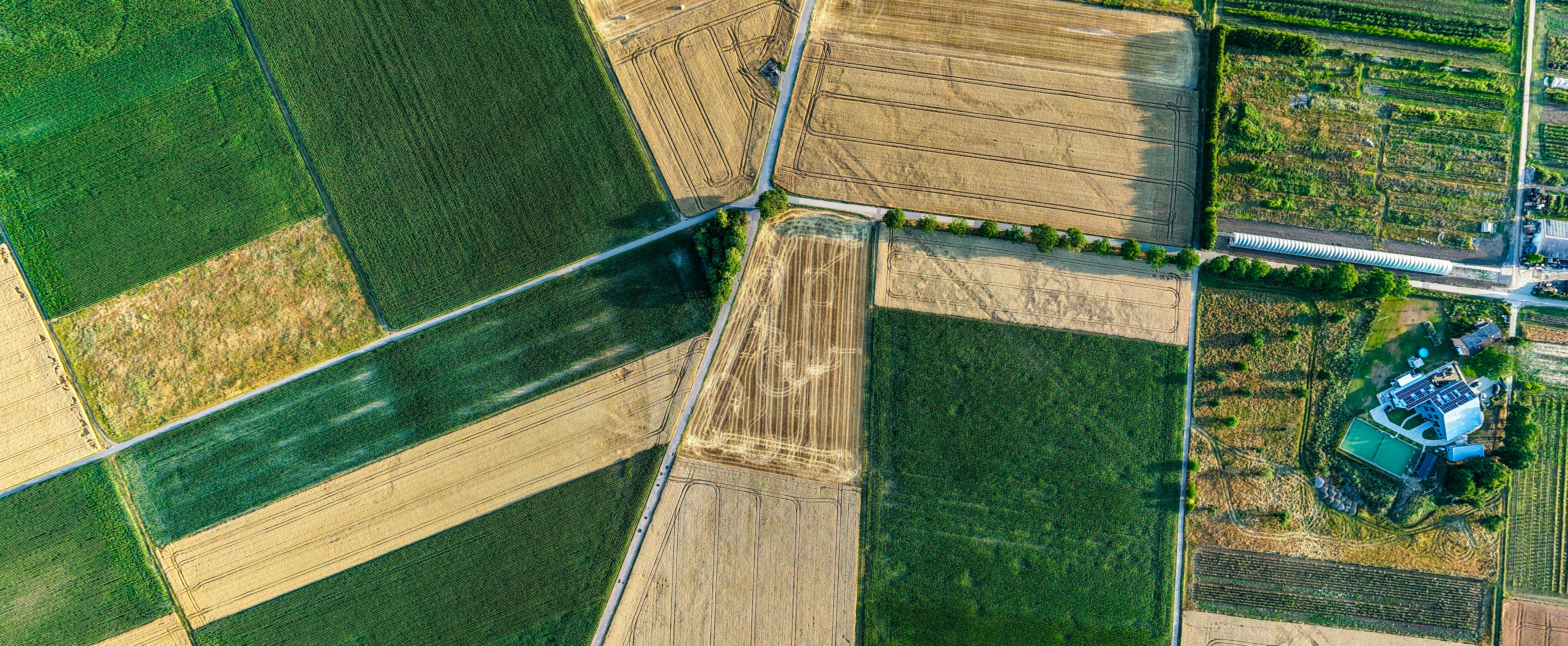 Aerial view of patchwork farmland and open acreage
